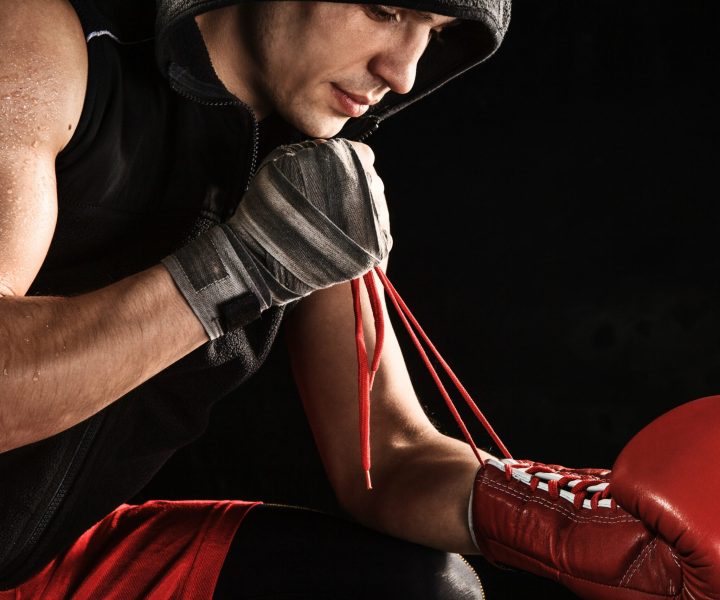 the-young-man-kickboxing-lacing-glove-2021-08-26-17-41-07-utc-min